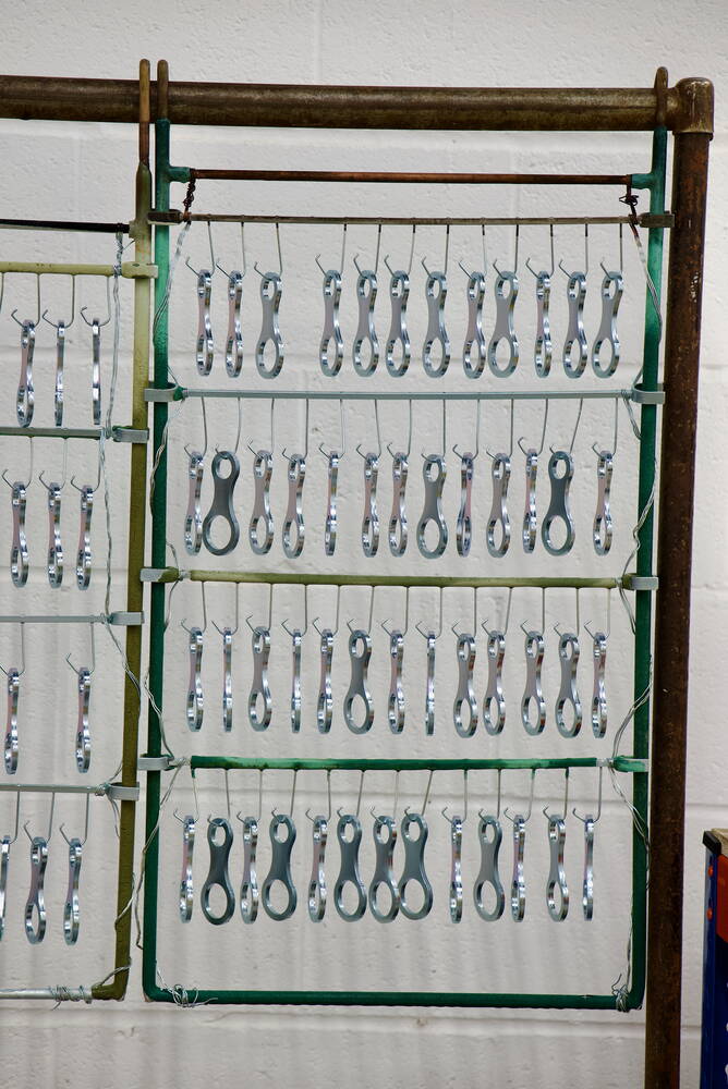 Plated rail components finished for long-life corrosion protection